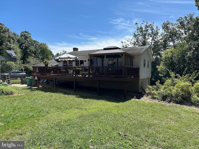 back of house with a yard and a wooden deck