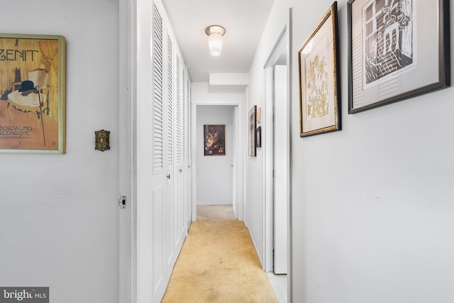 corridor featuring light carpet