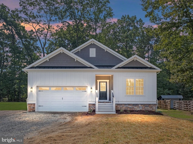 view of front of home featuring a garage and a lawn