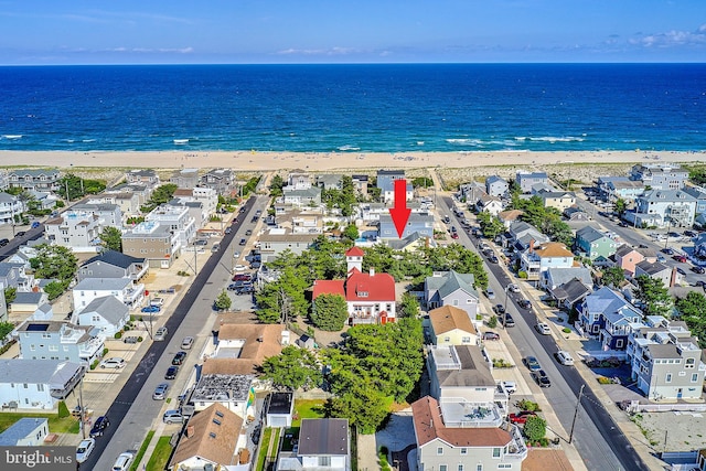 bird's eye view with a beach view and a water view