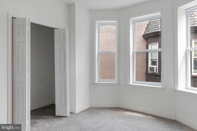 unfurnished bedroom with carpet and baseboards