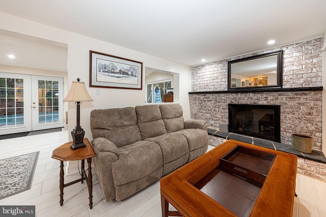 living room with a fireplace and french doors