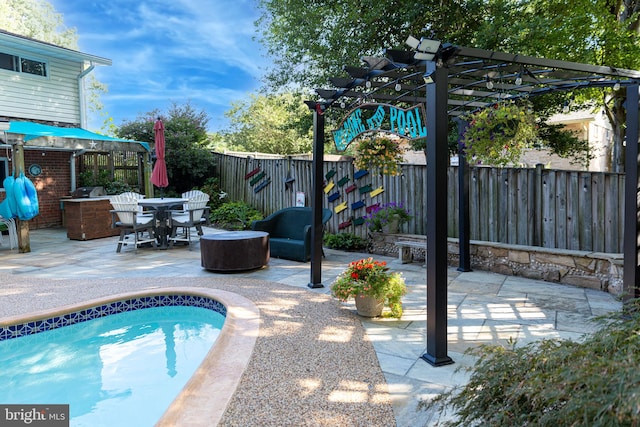 view of pool with a pergola and a patio area