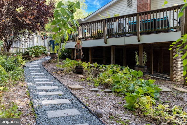 view of yard featuring a wooden deck