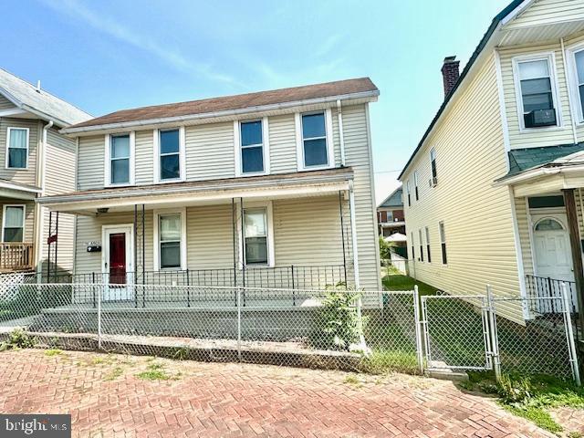 townhome / multi-family property with covered porch