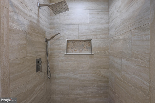 bathroom featuring tiled shower