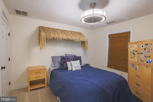 carpeted bedroom with a textured ceiling