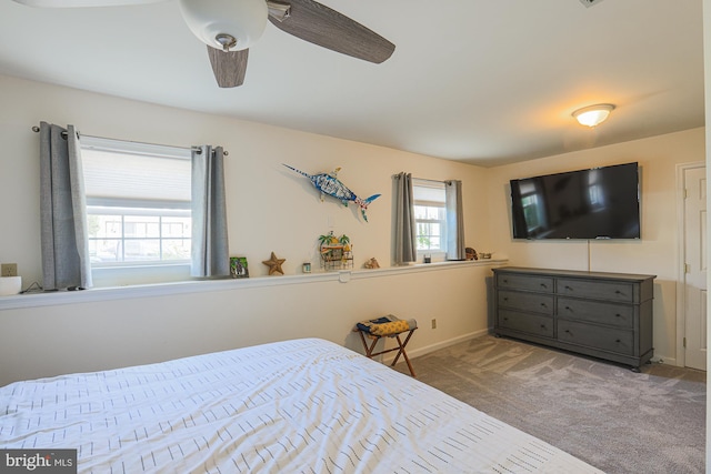 bedroom with ceiling fan and carpet floors