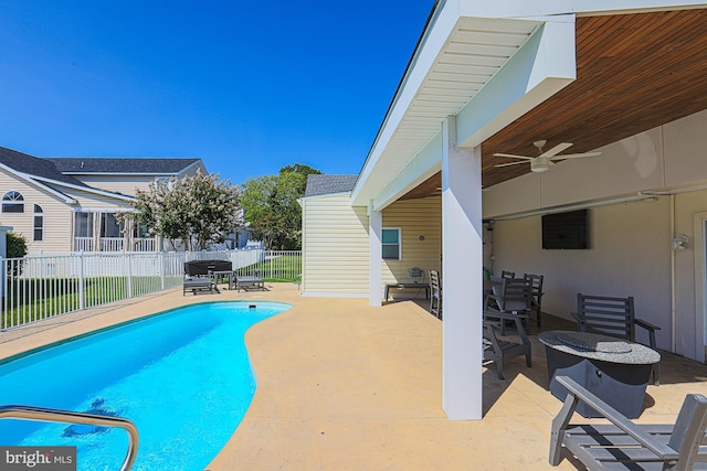 view of swimming pool with a patio area and ceiling fan