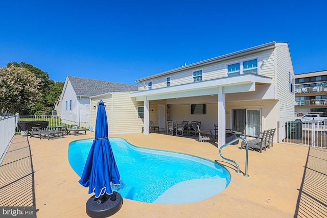 view of swimming pool with a patio