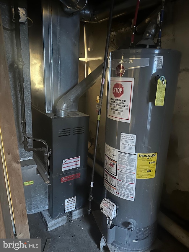 utility room featuring water heater