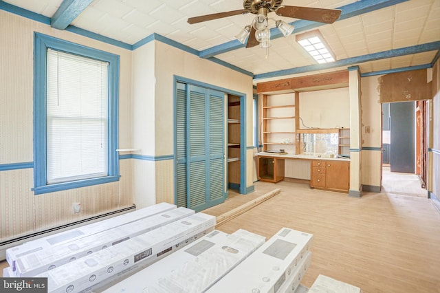 interior space with a closet, ceiling fan, and light hardwood / wood-style flooring