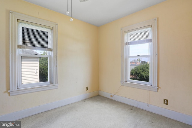 unfurnished room featuring carpet flooring