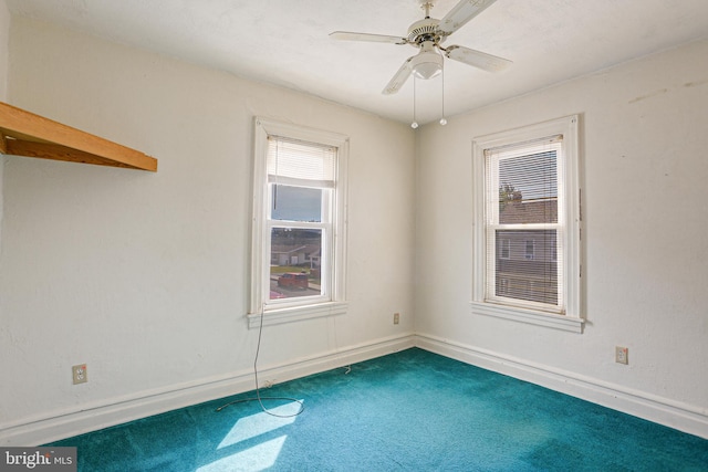 spare room with ceiling fan and carpet floors