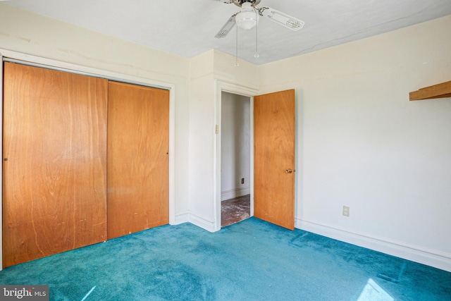 unfurnished bedroom featuring carpet and a closet