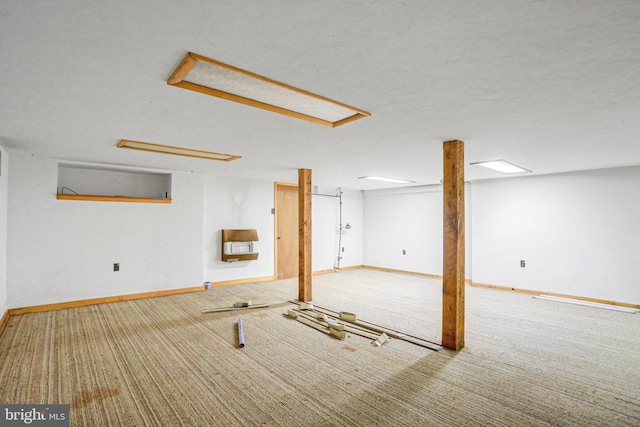 basement featuring a textured ceiling and light carpet