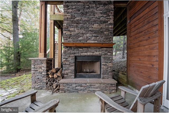 view of patio with an outdoor stone fireplace