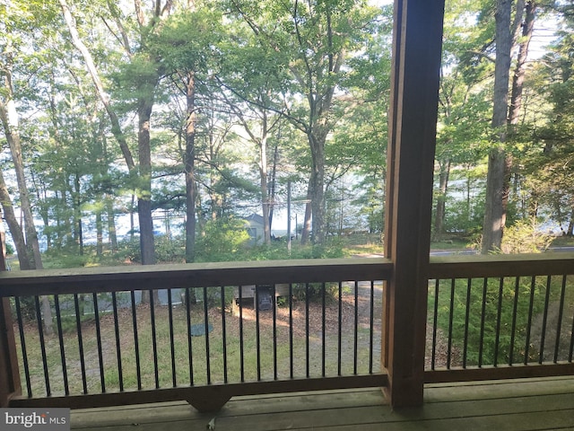 wooden deck featuring a water view