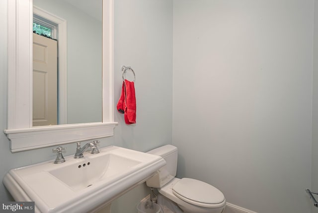 bathroom featuring toilet and sink