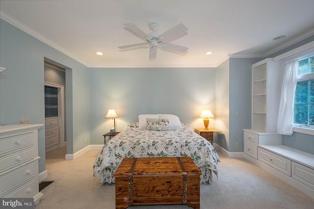 carpeted bedroom with crown molding and ceiling fan