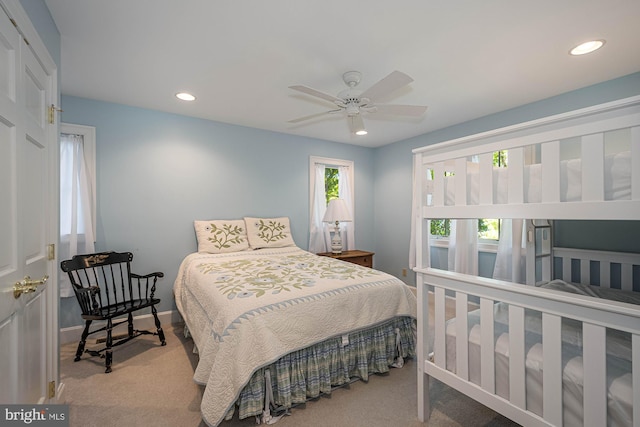 carpeted bedroom featuring ceiling fan