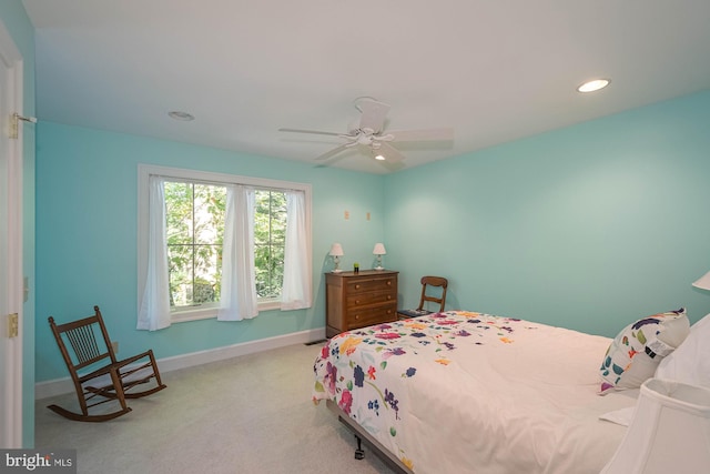 carpeted bedroom featuring ceiling fan