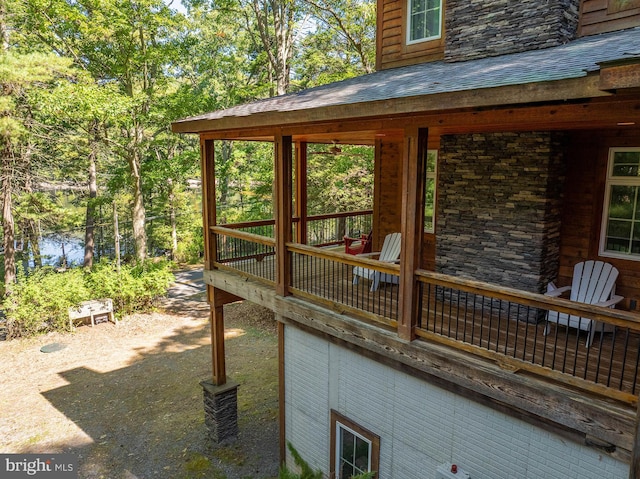 wooden deck with a water view