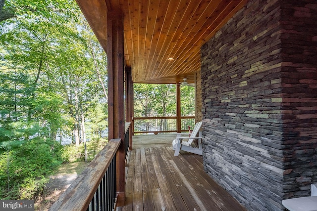 wooden deck featuring ceiling fan