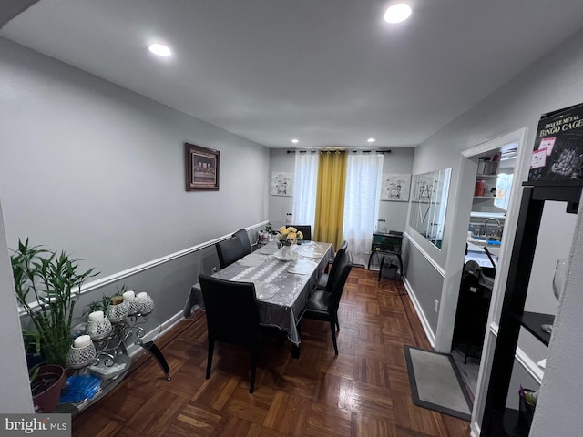 dining room featuring dark parquet floors