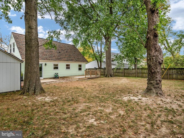 view of yard featuring a wooden deck