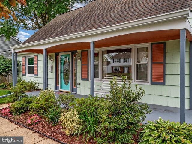 doorway to property featuring a porch