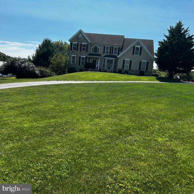 view of front of property with a front lawn