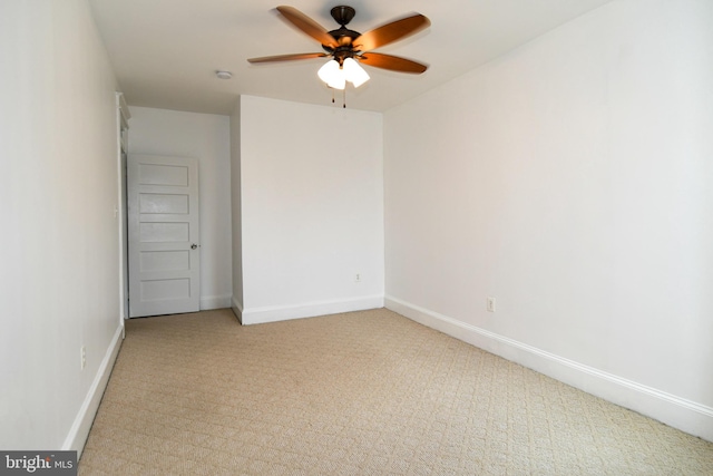 unfurnished room with ceiling fan and carpet floors