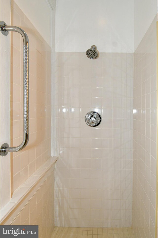 bathroom with tiled shower