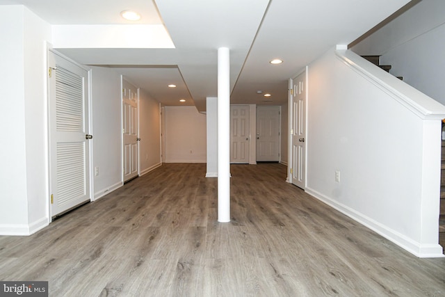 basement featuring hardwood / wood-style floors