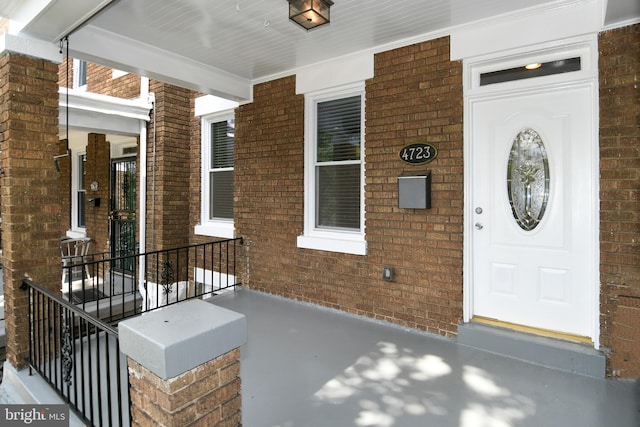 entrance to property with a porch