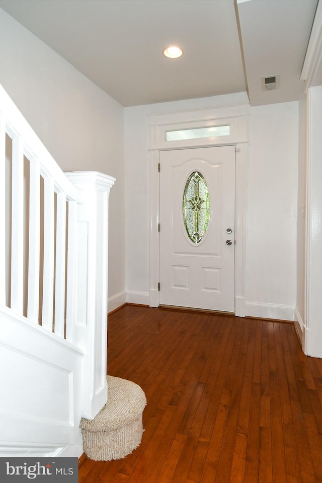 foyer entrance with dark hardwood / wood-style flooring