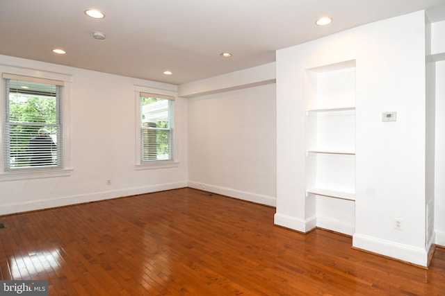 spare room with hardwood / wood-style flooring