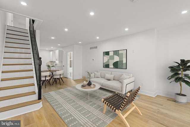 living room with light hardwood / wood-style floors