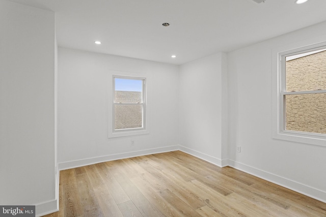 spare room featuring light hardwood / wood-style floors