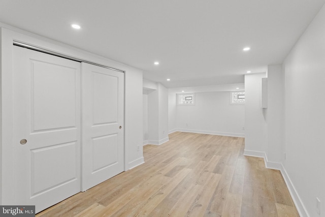 basement featuring light hardwood / wood-style floors