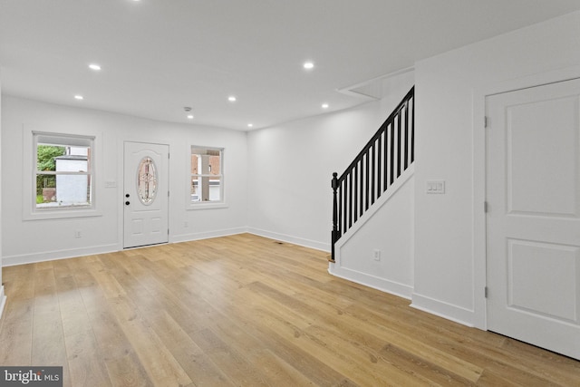 foyer entrance with light hardwood / wood-style flooring