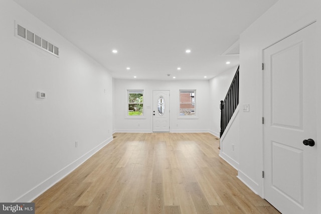 unfurnished living room with light hardwood / wood-style floors