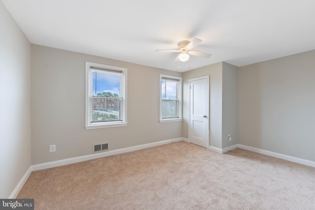 unfurnished bedroom featuring visible vents, a ceiling fan, baseboards, and carpet floors