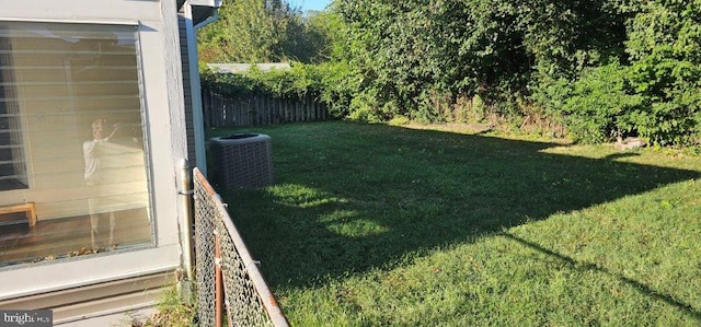 view of yard featuring central air condition unit