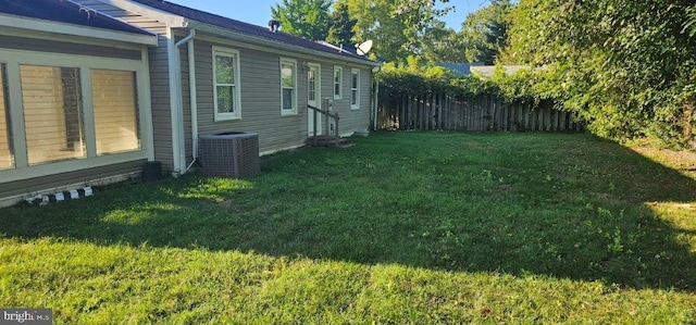 view of yard featuring central AC unit