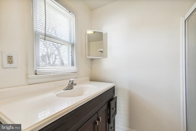 bathroom with vanity and a wealth of natural light