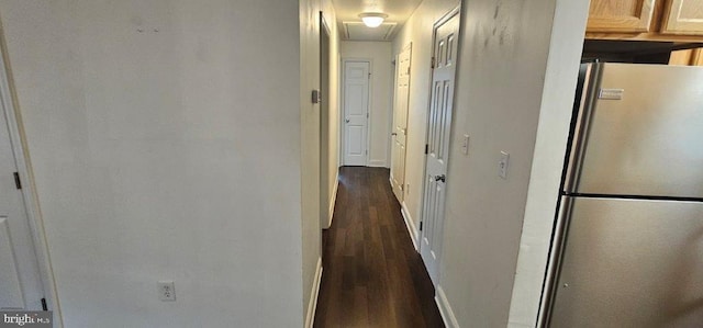 hallway with dark hardwood / wood-style floors