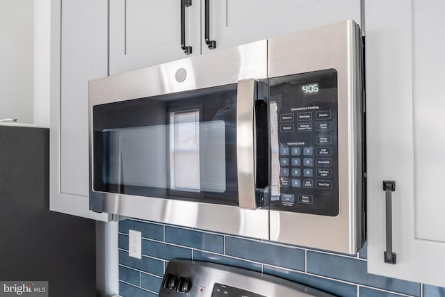 details with tasteful backsplash and white cabinetry