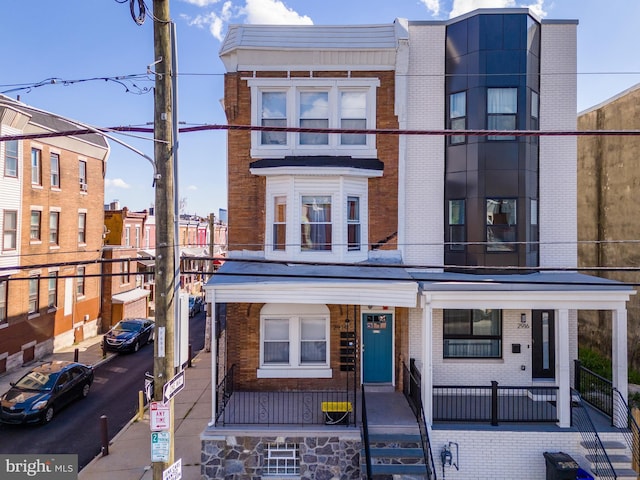 view of property featuring brick siding